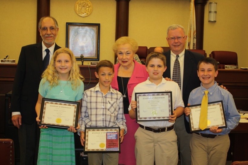 Monmouth County Historical Commission Executive Director John Fabiano, Freeholder Director Lillian G. Burry and Commissioner Glenn Cashion congratulate fifth-grade essay contest winners Allie Van Pelt, William Hurley, Hunter Lane and Matthew Desiderio at the Monmouth County Historical Commission Preservation Award ceremony on June 2, 2014 in Freehold, NJ.