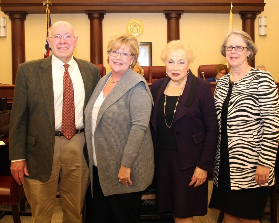Monmouth County Historical Commissioner Randall Gabrielan and Freeholder Lillian G. Burry (second from right) congratulate Monmouth County Historical Association President Linda Bricker (second from left) and Director Evelyn Murphy (right) for being chosen to receive a $4,500 preservation grant for exterior restoration to Marlpit Hall in Middletown.