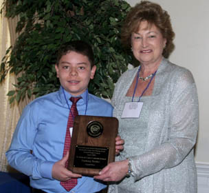 Freeholder Director Barbara McMorrow congratulates Zachary Tretier, winner of the 2009 Monmouth County Fair Housing Art Contest