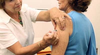 A nurse administers a flu shot