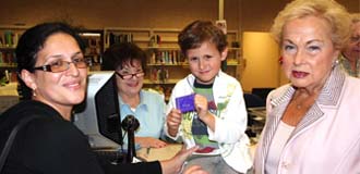 Freeholder Lillian Burry with Monmouth County Library patrons and staff