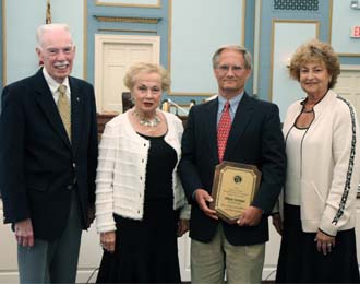 Freeholder Director Barbara McMorrow and Freeholder Lillian Burry present an open space award to William Hennigan